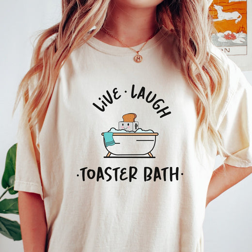 Comfort Colors tee in Ivory featuring cute graphic style of a smiling toaster sitting in a bathtub