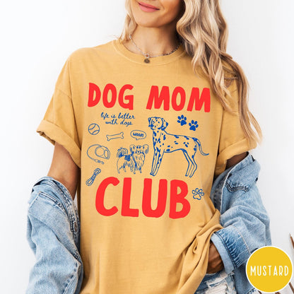 Comfort Colors tee in Mustard featuring playful dog-themed graphic with Dalmatian and text Dog Mom Club