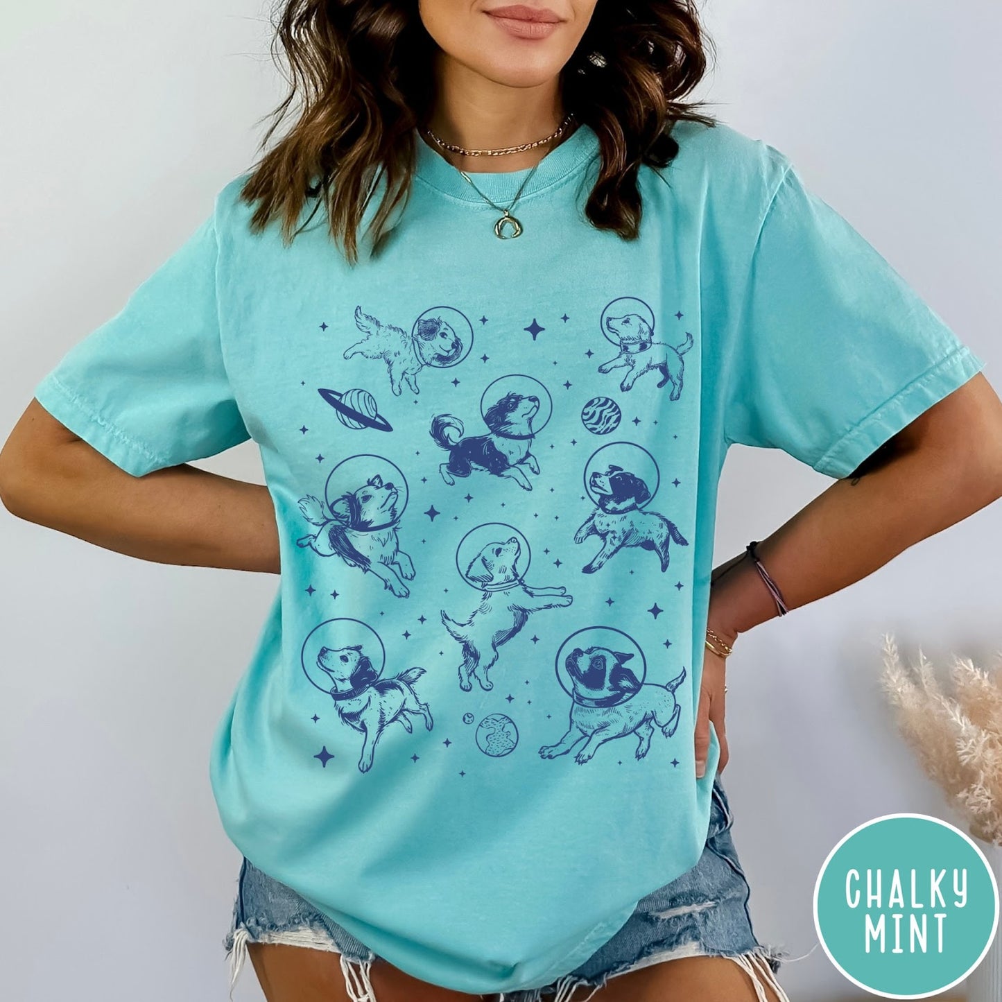Comfort Colors tee in Chalky Mint featuring space theme graphic with various dogs wearing astronaut helmets and planets