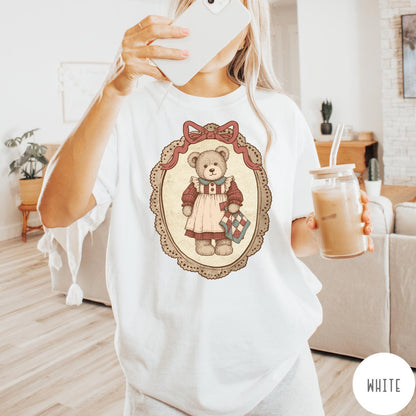 Comfort Colors tee in White featuring vintage style teddy bear graphic inside a decorative lace oval frame
