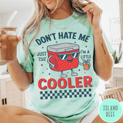 Comfort Colors tee in Island Reef featuring retro cooler graphic with sunglasses and a drink with text