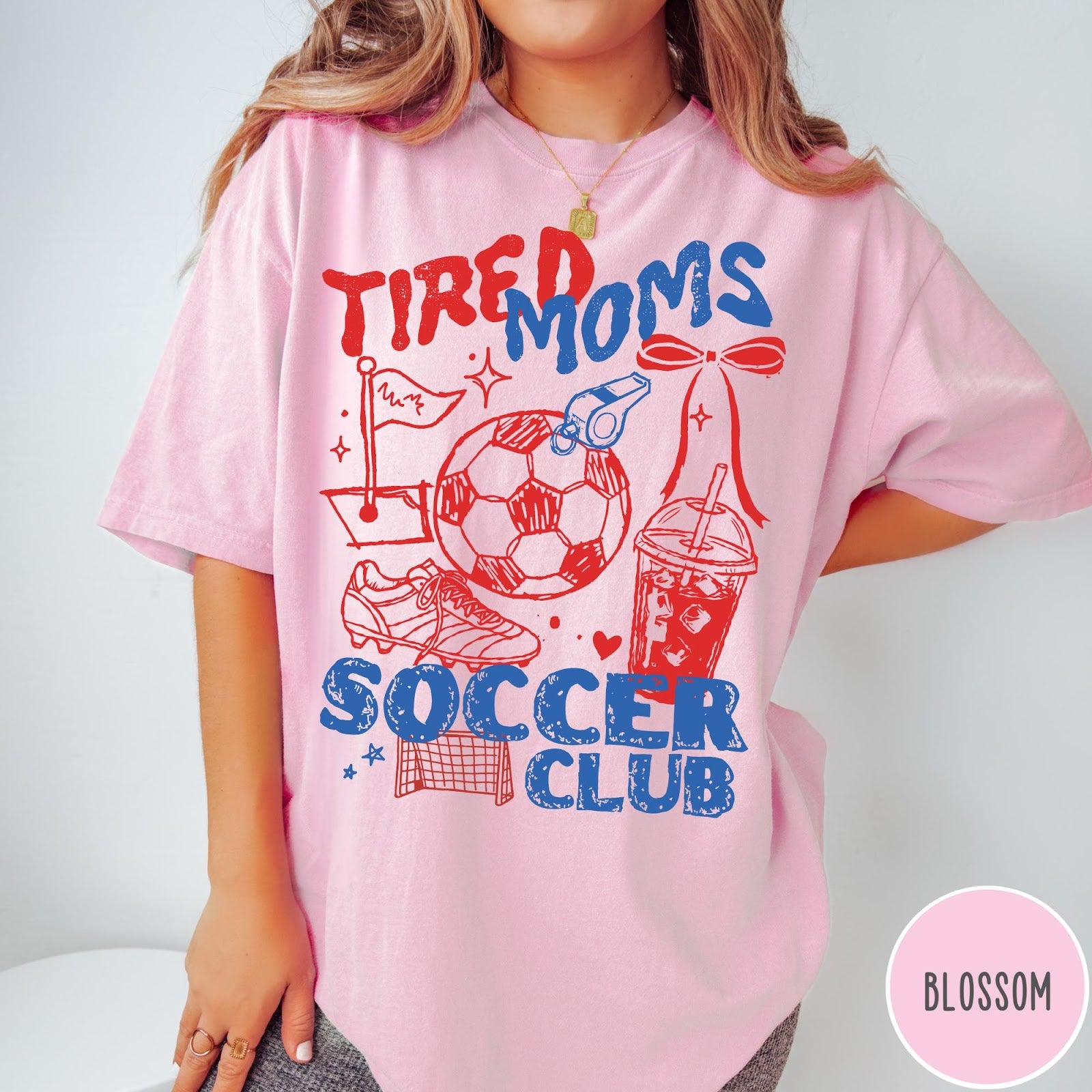 Comfort Colors tee in Blossom featuring soccer mom life graphic with soccer ball and iced coffee
