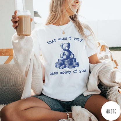 Comfort Colors tee in White featuring graphic style teddy bear sitting on a stack of coins