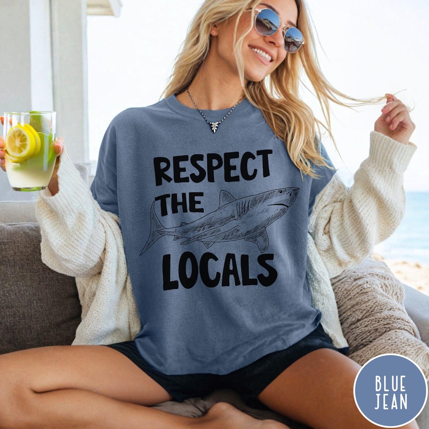 Comfort Colors tee in Blue Jean featuring sketch style shark graphic with Respect the Locals text design