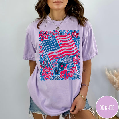 Comfort Colors tee in Orchid featuring boho style American flag and floral graphic design