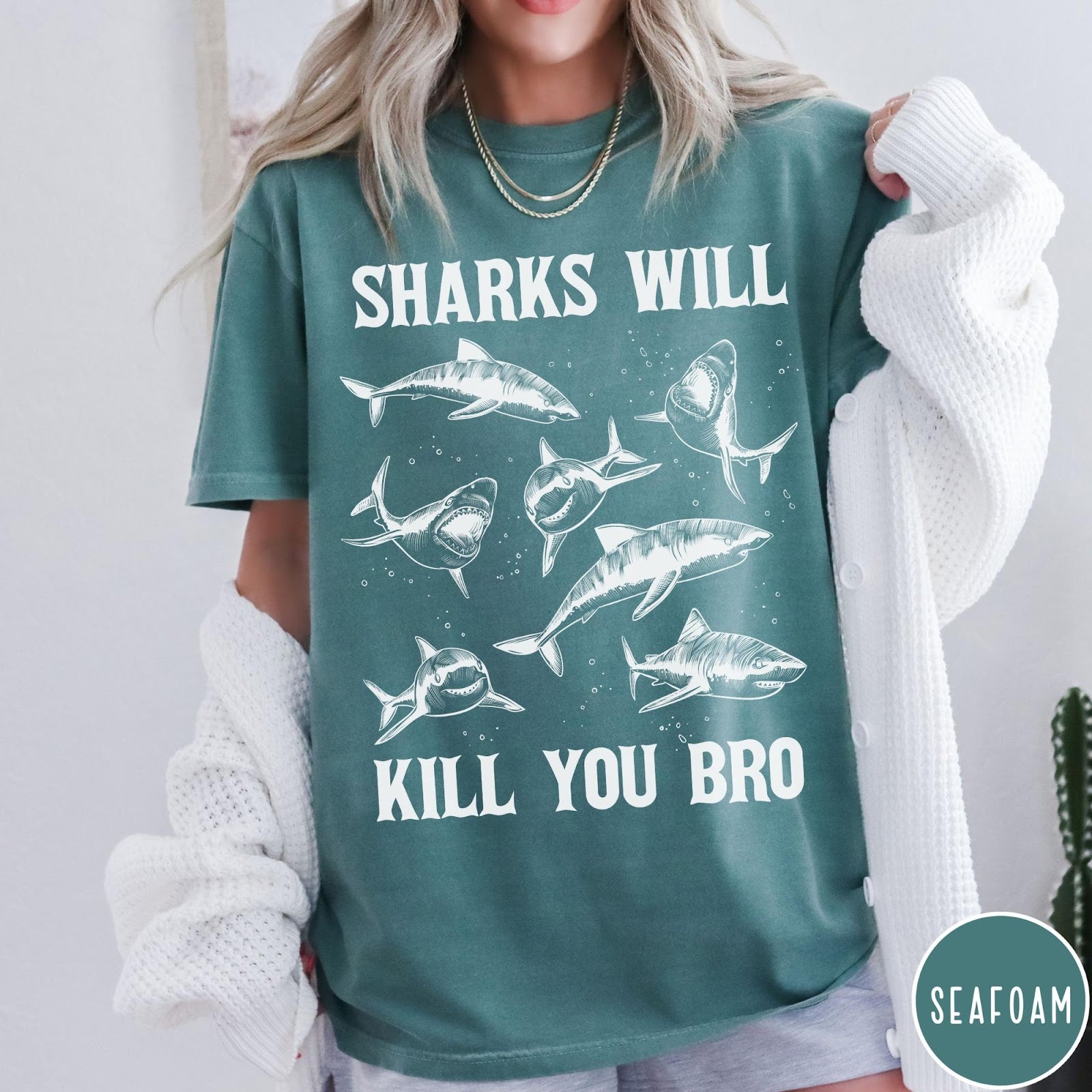 Comfort Colors tee in Seafoam featuring illustrative style graphic of multiple sharks and text Sharks Will Kill You
