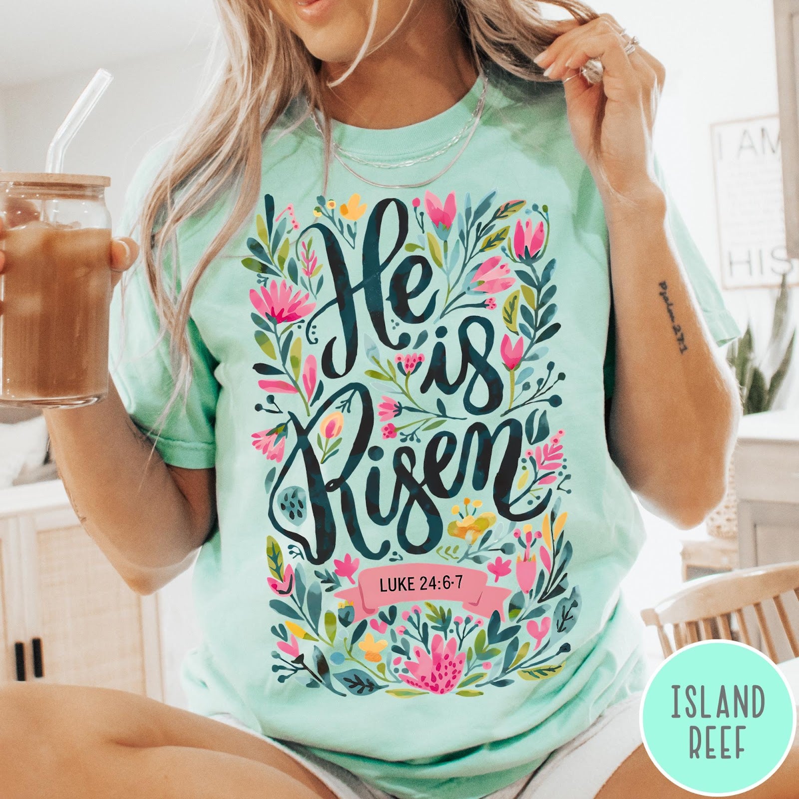 Comfort Colors tee in Island Reef featuring Easter religious floral graphic with He is Risen and Luke 24:6-7 text