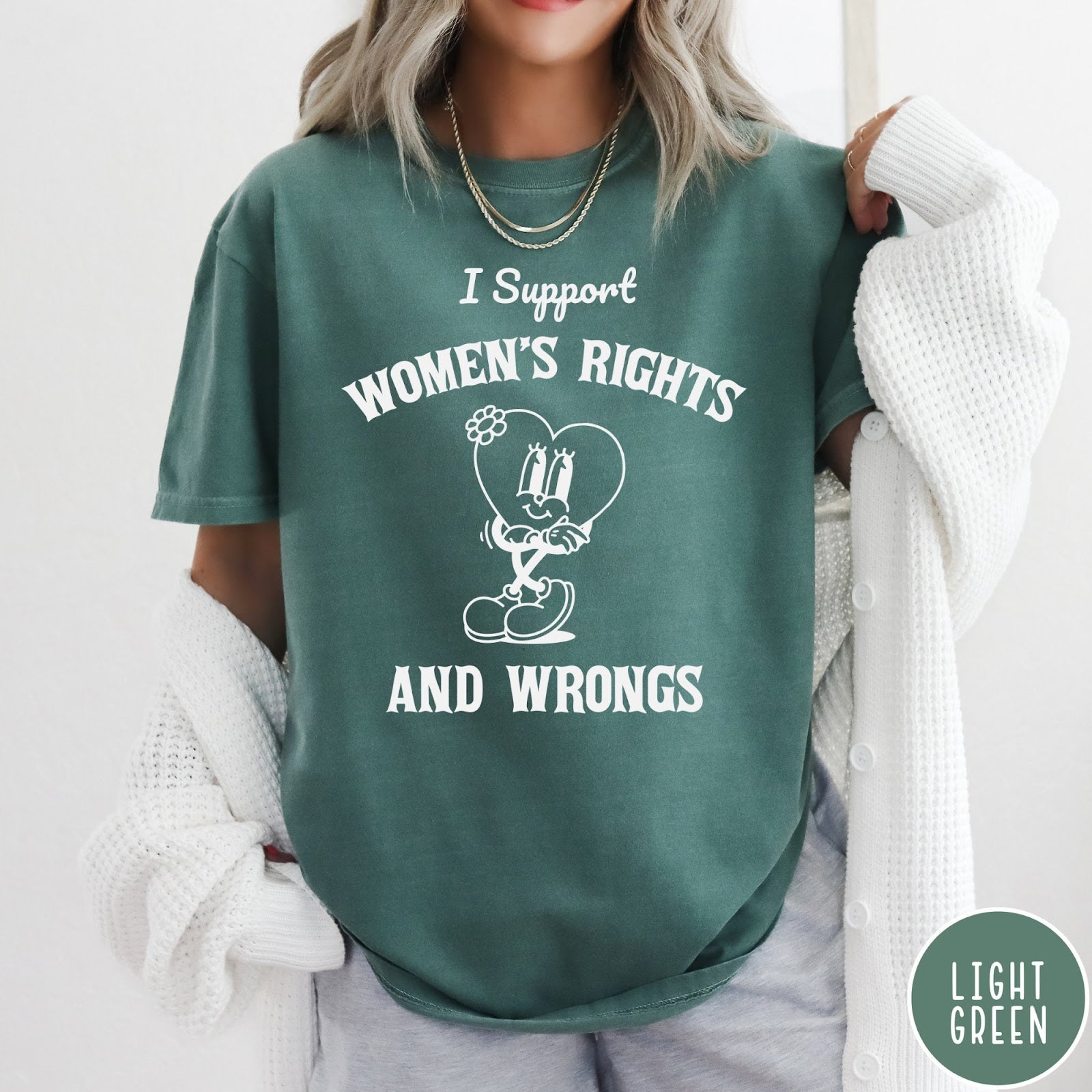 Comfort Colors tee in Light Green featuring retro style heart mascot graphic with women's rights text