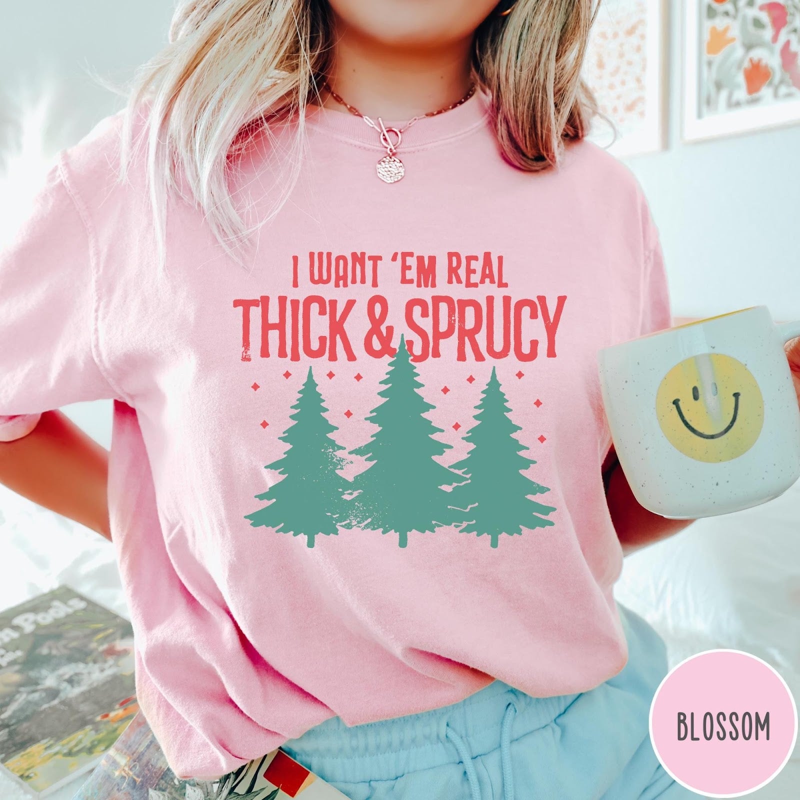 Comfort Colors tee in Blossom featuring Christmas tree design with text I Want Em Real Thick and Sprucy