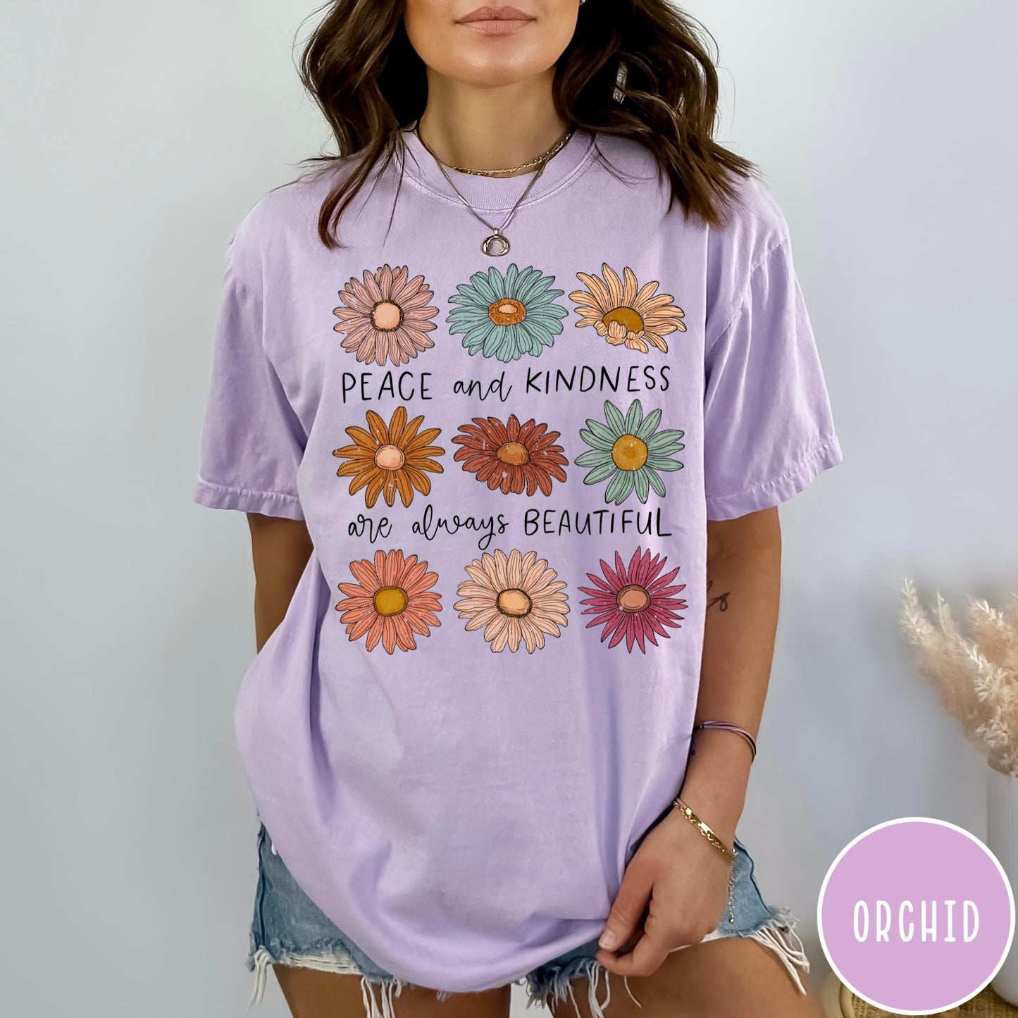 Comfort Colors tee in Orchid featuring floral design with Peace and Kindness are always beautiful text graphic