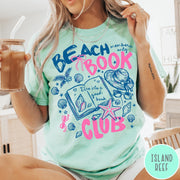 Comfort Colors tee in Island Reef featuring beach book club graphic with seashells, starfish, and a sun hat