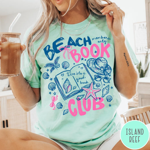 Comfort Colors tee in Island Reef featuring beach book club graphic with seashells, starfish, and a sun hat
