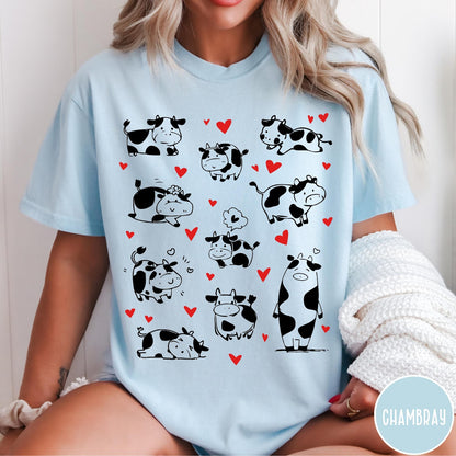 Comfort Colors tee in Chambray featuring cute cow lover graphic with various black and white cow illustrations