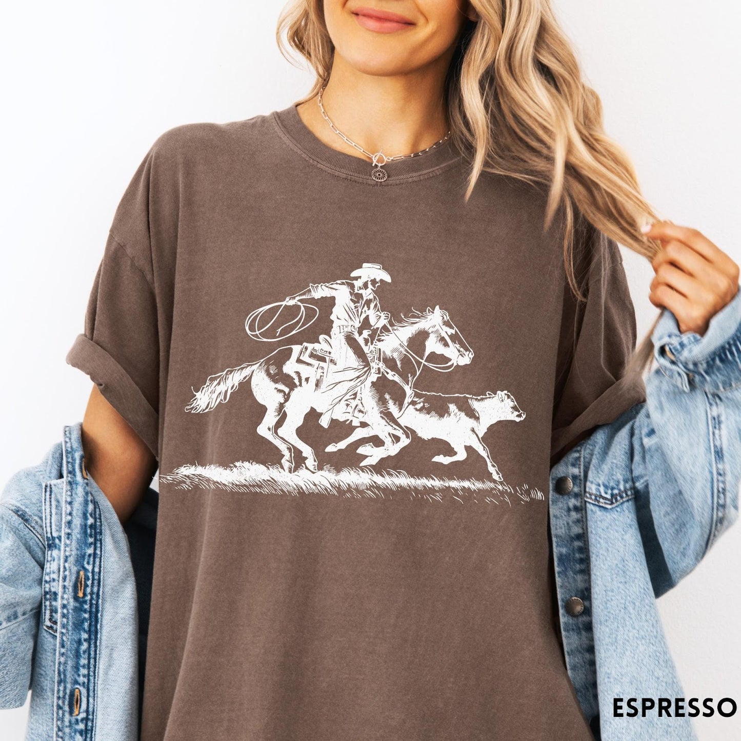 Comfort Colors tee in Espresso featuring western style graphic of a cowboy roping a calf on horseback