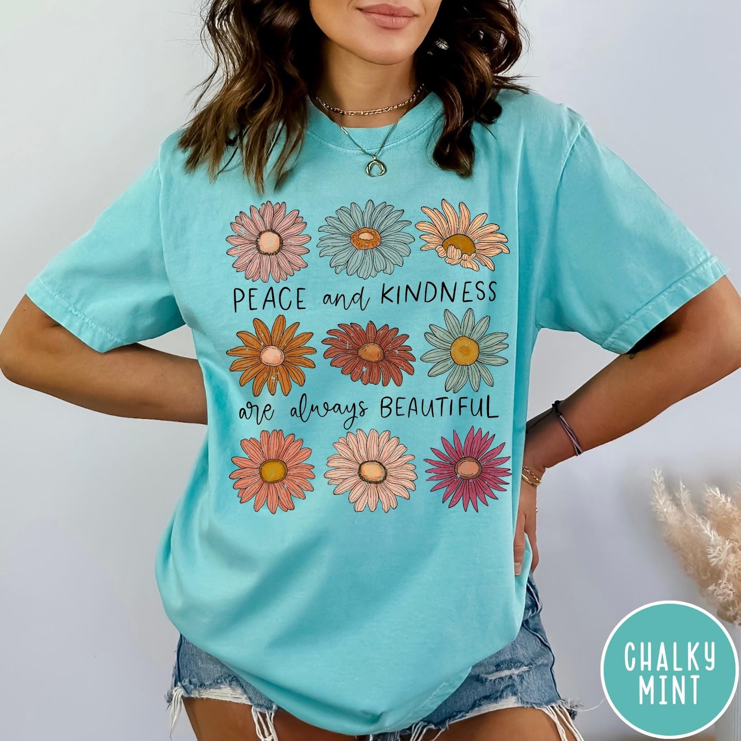 Comfort Colors tee in Chalky Mint featuring floral style graphic with daisies and text Peace and Kindness are always beautiful