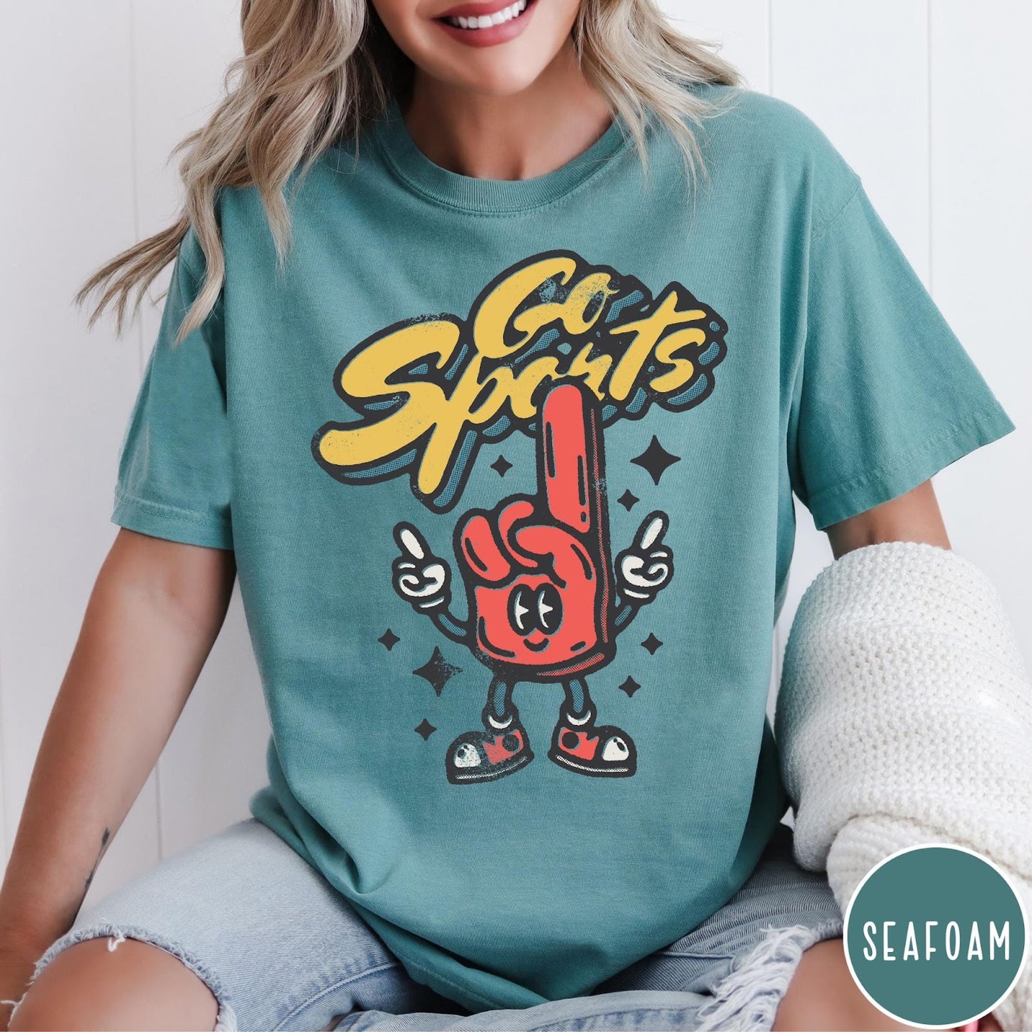 Comfort Colors tee in Seafoam featuring retro mascot design with a red foam finger character and text