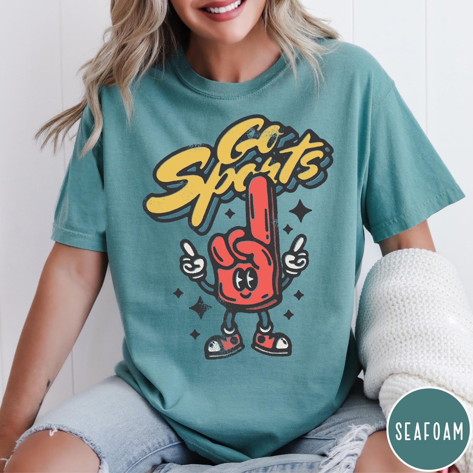Comfort Colors tee in Seafoam featuring retro mascot design with a red foam finger character and text