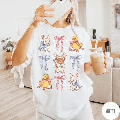 Comfort Colors tee in White featuring vintage style graphic with Easter bunnies, ducks, and pink blue bows