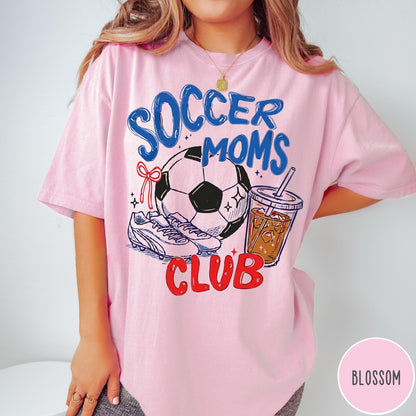 Comfort Colors tee in Blossom featuring soccer mom lifestyle graphic with soccer ball, cleats, and iced coffee