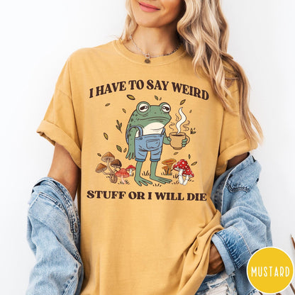 Comfort Colors tee in Mustard featuring illustrative frog graphic with coffee cup and various forest mushrooms