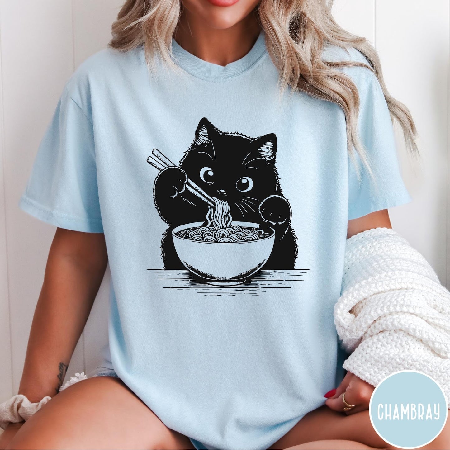 Comfort Colors tee in Chambray featuring graphic illustration of a cute black cat eating a bowl of ramen