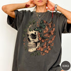 Comfort Colors tee in Pepper featuring vintage style graphic with a skull surrounded by various colorful butterflies