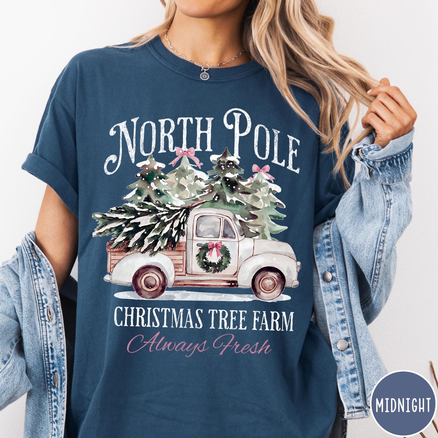Comfort Colors tee in Midnight featuring vintage style Christmas tree farm truck graphic with snowy pine trees
