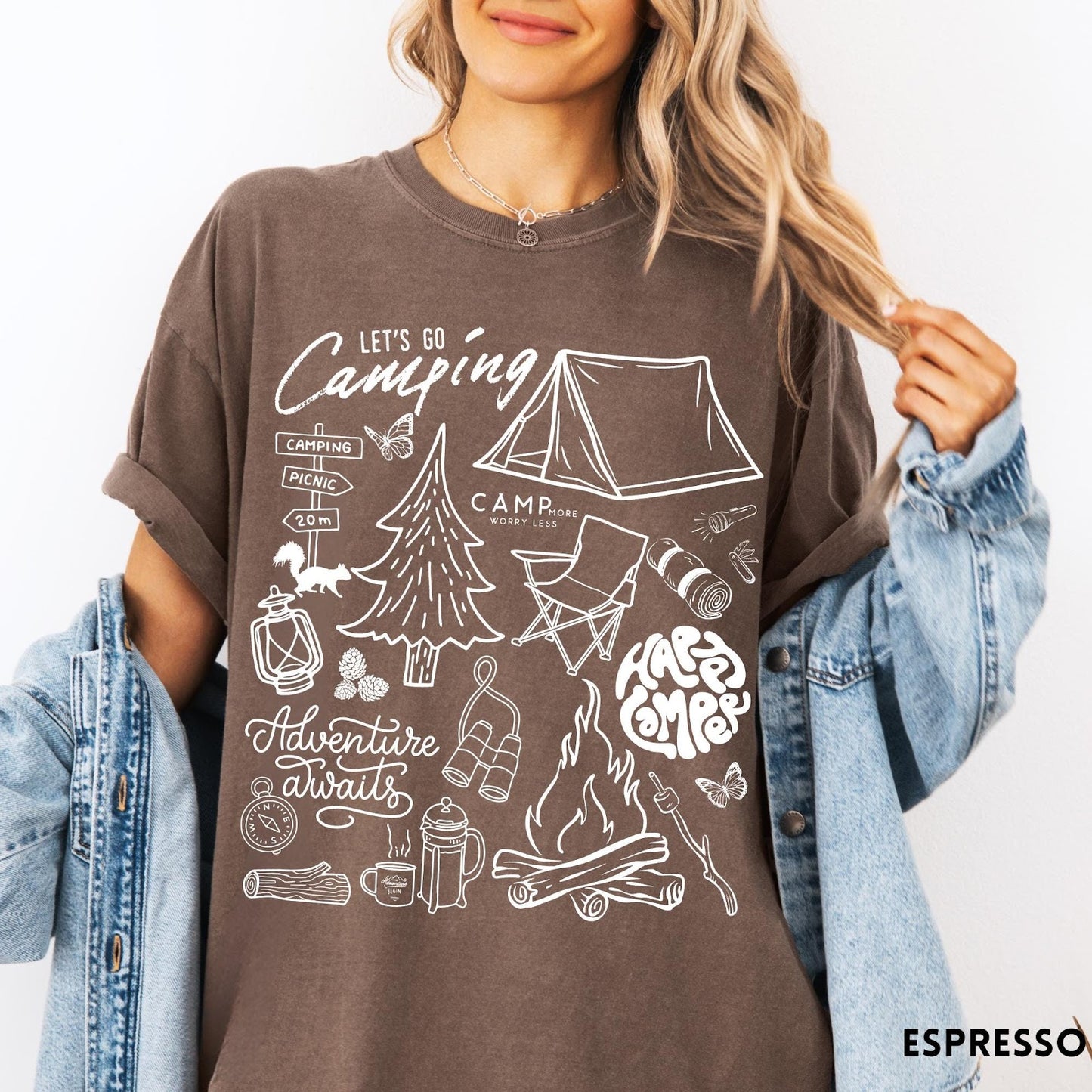 Comfort Colors tee in Espresso featuring retro camping adventure collage graphic with tent, campfire, and outdoor icons