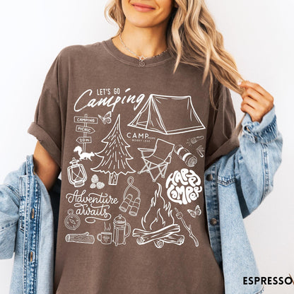 Comfort Colors tee in Espresso featuring retro camping adventure collage graphic with tent, campfire, and outdoor icons