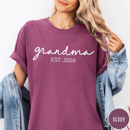 Comfort Colors tee in Berry featuring cursive Grandma Est 2026 text in a clean white graphic style