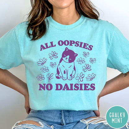 Comfort Colors tee in Chalky Mint featuring cute cat graphic with purple text reading All Oopsies No Daisies
