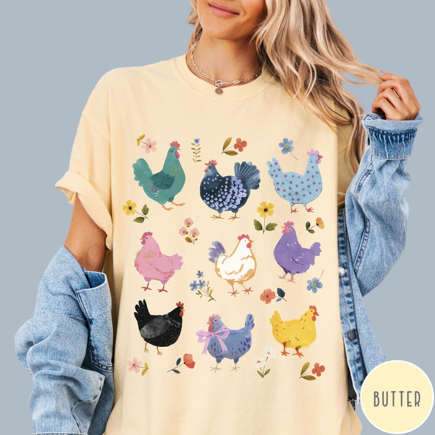 Comfort Colors tee in Butter featuring vintage style graphic with various colorful chickens and small floral accents