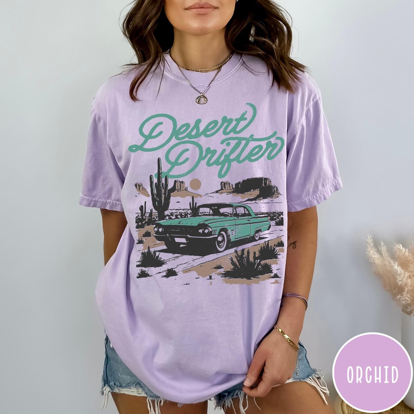 Comfort Colors tee in Orchid featuring vintage style graphic of a classic car in a desert landscape