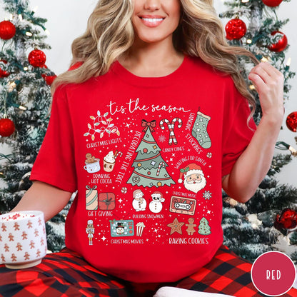 Comfort Colors tee in Red featuring festive holiday graphic with Christmas icons like a tree and cocoa
