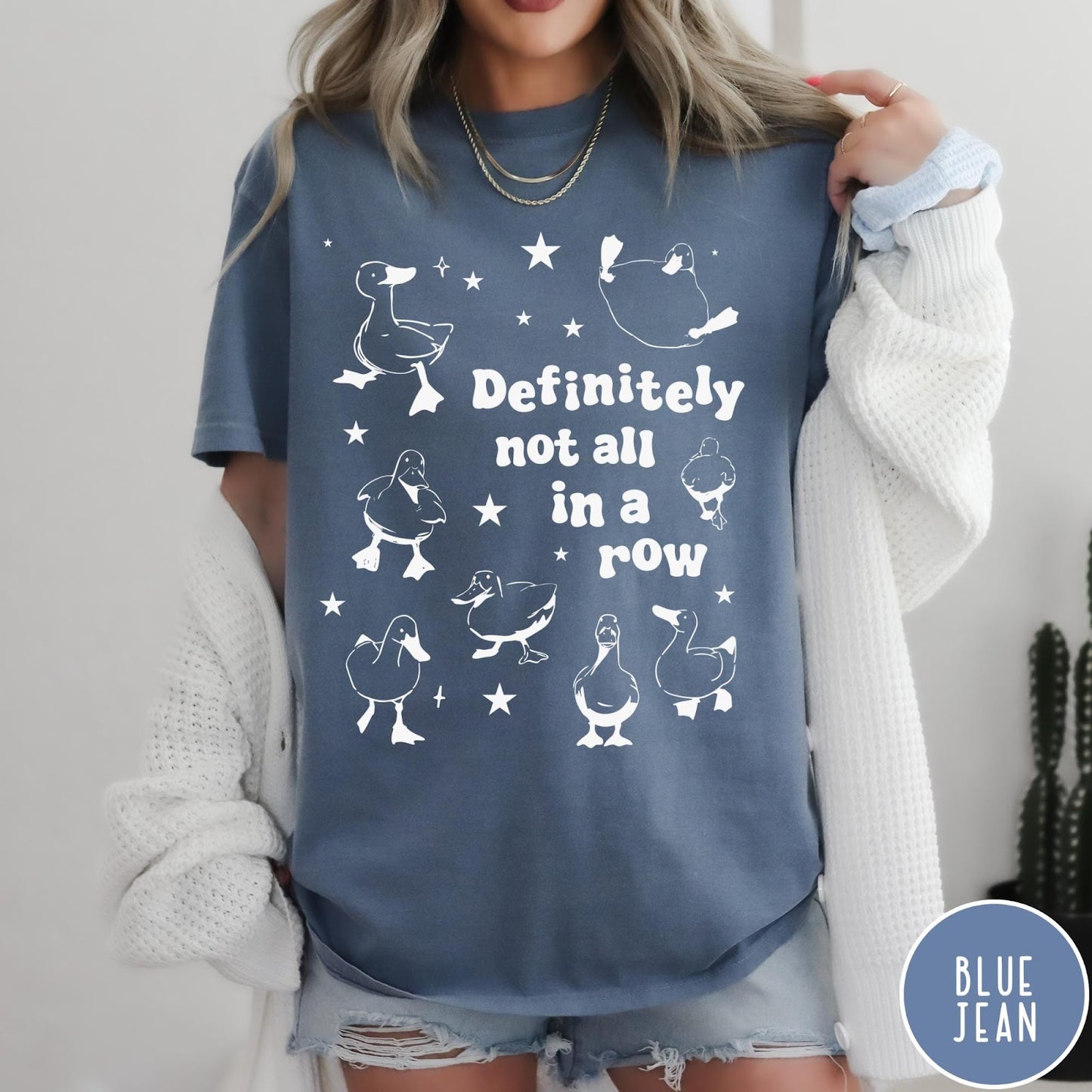 Comfort Colors tee in Blue Jean featuring whimsical duck design with scattered stars and text about ducks.
