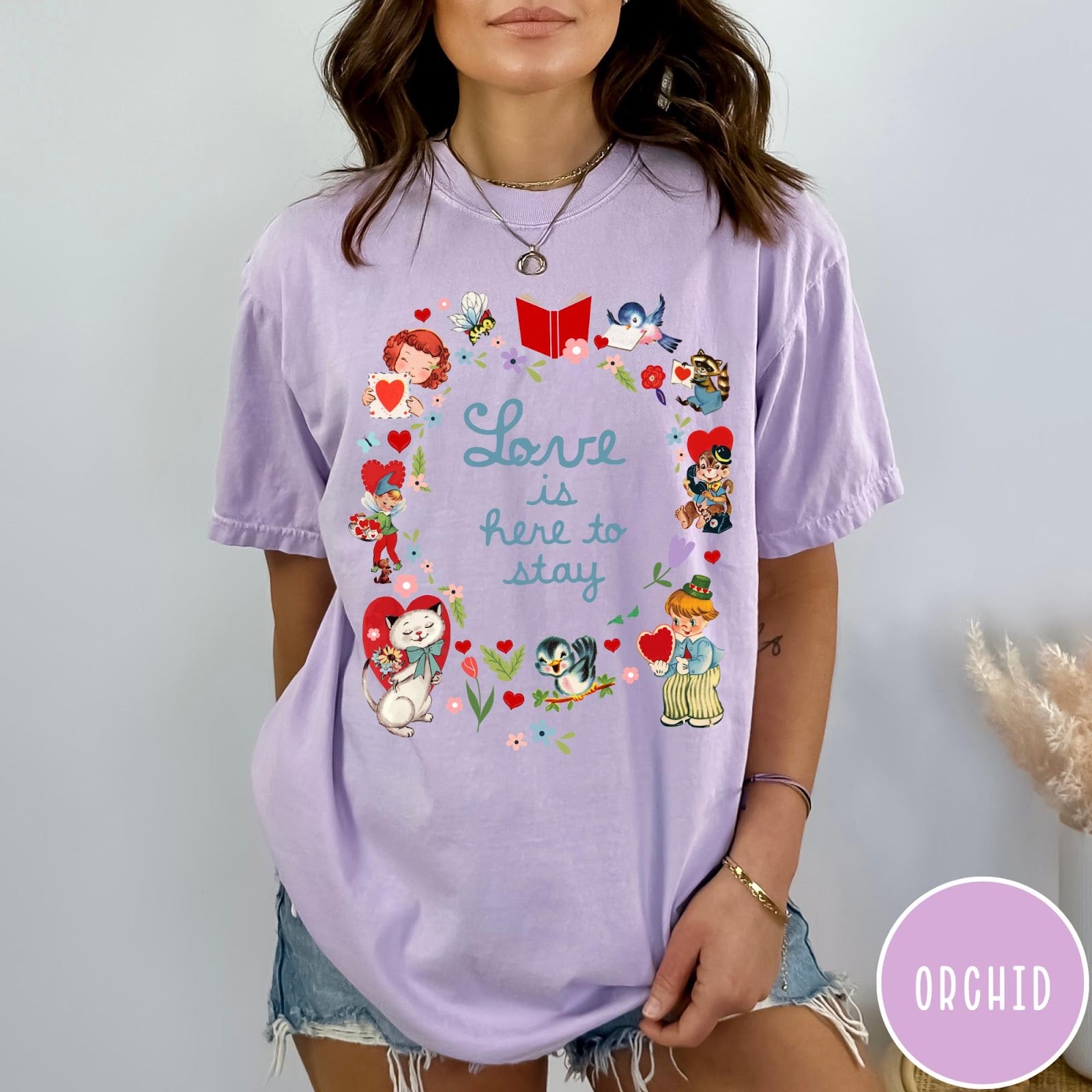 Comfort Colors tee in Orchid featuring vintage Valentine's collage with cute animals, flowers, and romantic text.