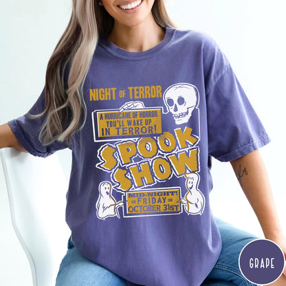 Comfort Colors tee in Grape featuring retro horror movie poster graphic with skull and spooky ghost illustrations