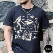 Comfort Colors tee in Black featuring vintage style graphic of Bigfoot, Loch Ness Monster, aliens, and UFOs