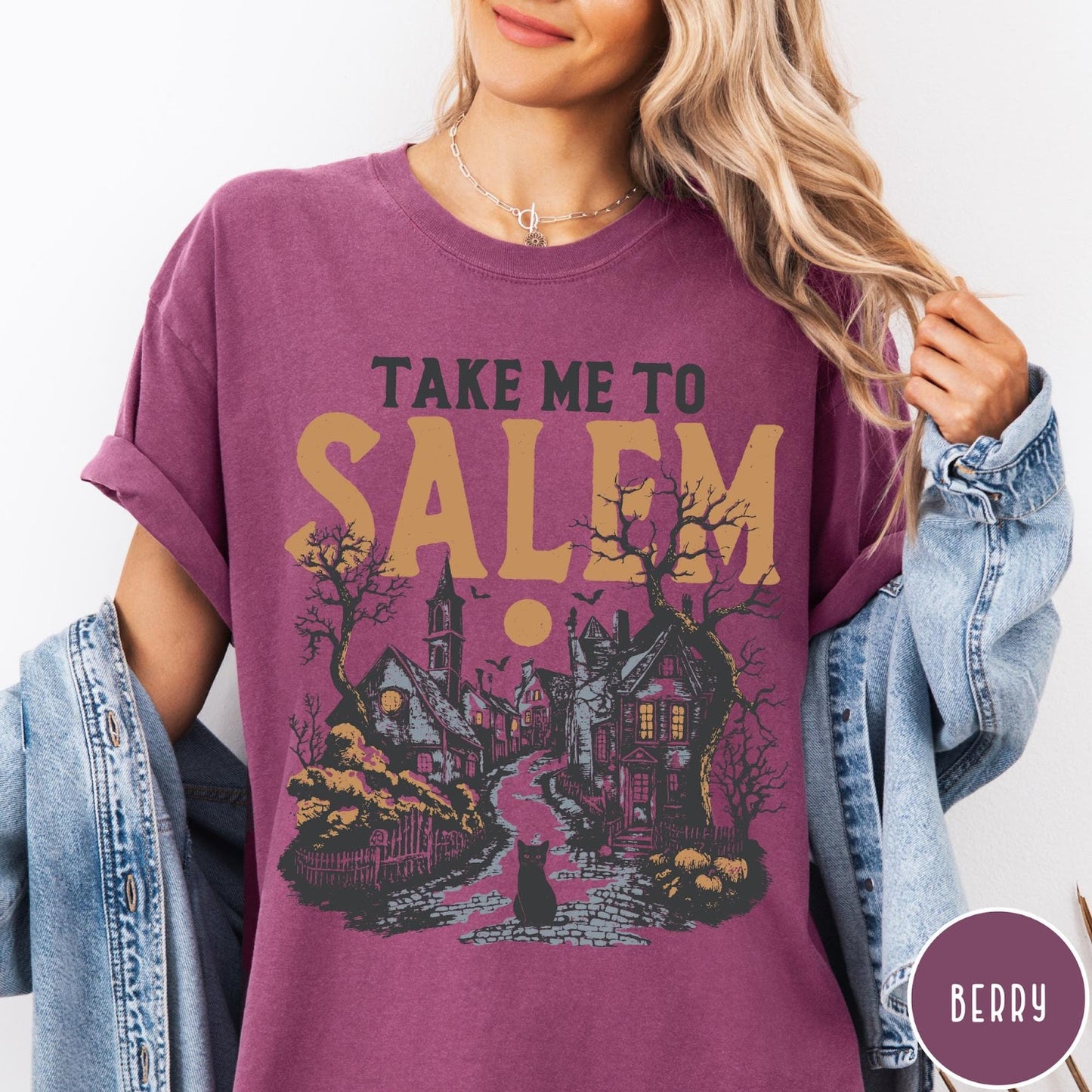 Comfort Colors tee in Berry featuring vintage style Salem town scene with black cat and pumpkins