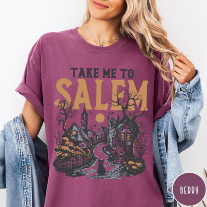 Comfort Colors tee in Berry featuring vintage style Salem town scene with black cat and pumpkins