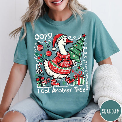 Comfort Colors tee in Seafoam featuring festive graphic design of a goose wearing a sweater and hat