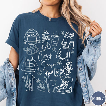 Comfort Colors tee in Midnight featuring line art winter activities and seasonal items graphic design